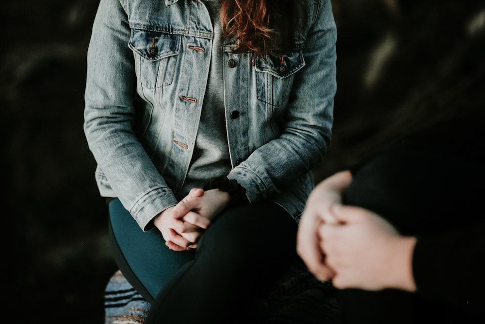 Cropped image of hands of a therapist and client